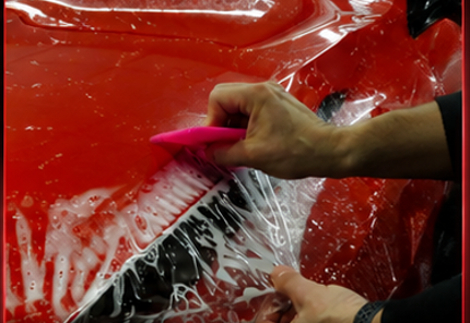 Self-healing Forever Young PPF installed on a red car body panel