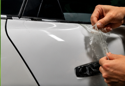 Crystal-clear, non-yellowing Forever Young PPF applied to a white car panel