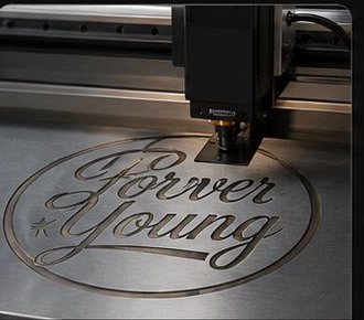 Laser logo engraving of the Forever Young mark for custom branding