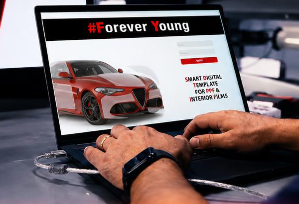 Forever Young Precut Software running on a laptop next to a film-cutting plotter, showing a smart digital template for PPF and interior films