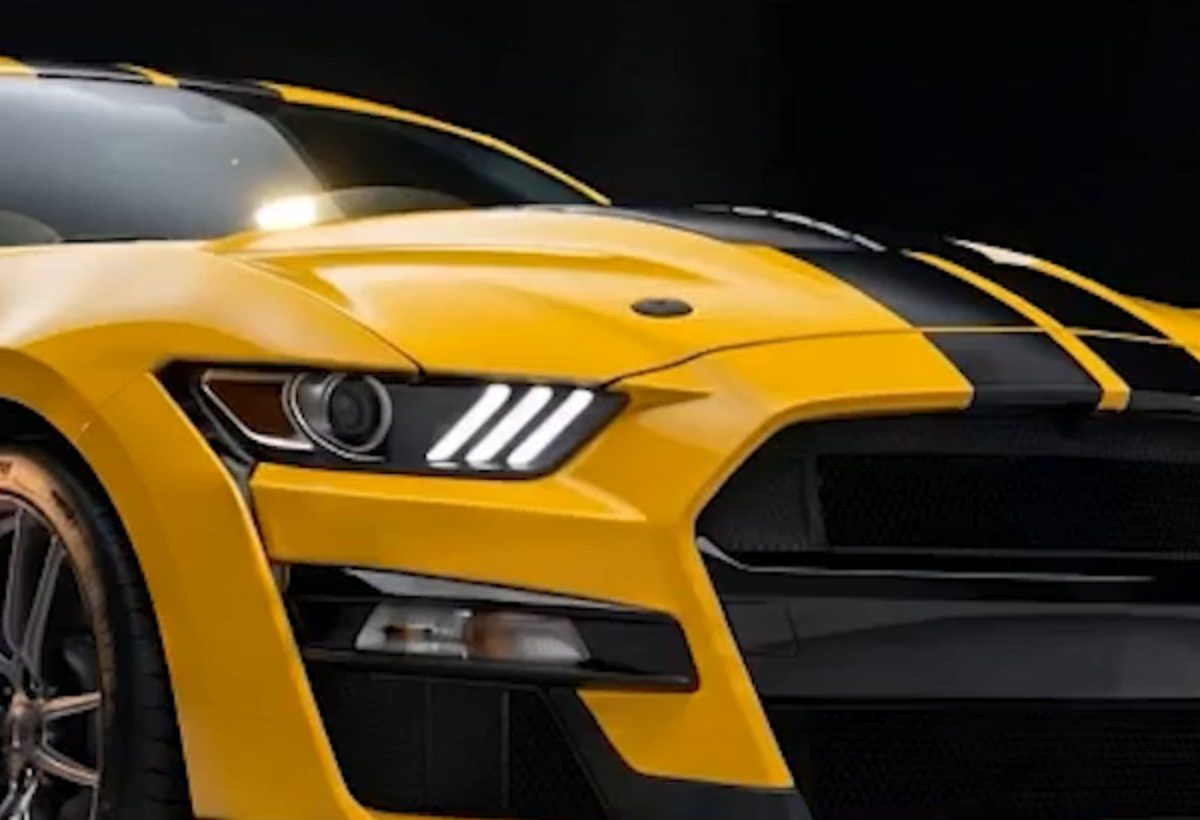 Clear, non-yellowing Forever Young PPF over the yellow paint and stripes of a Mustang
