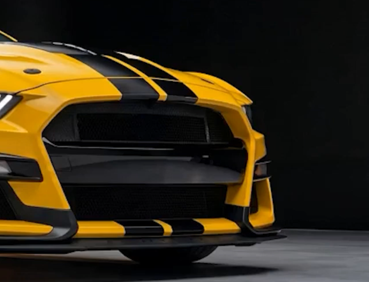 Flawless mirror-smooth Forever Young PPF finish on the front of a yellow Mustang