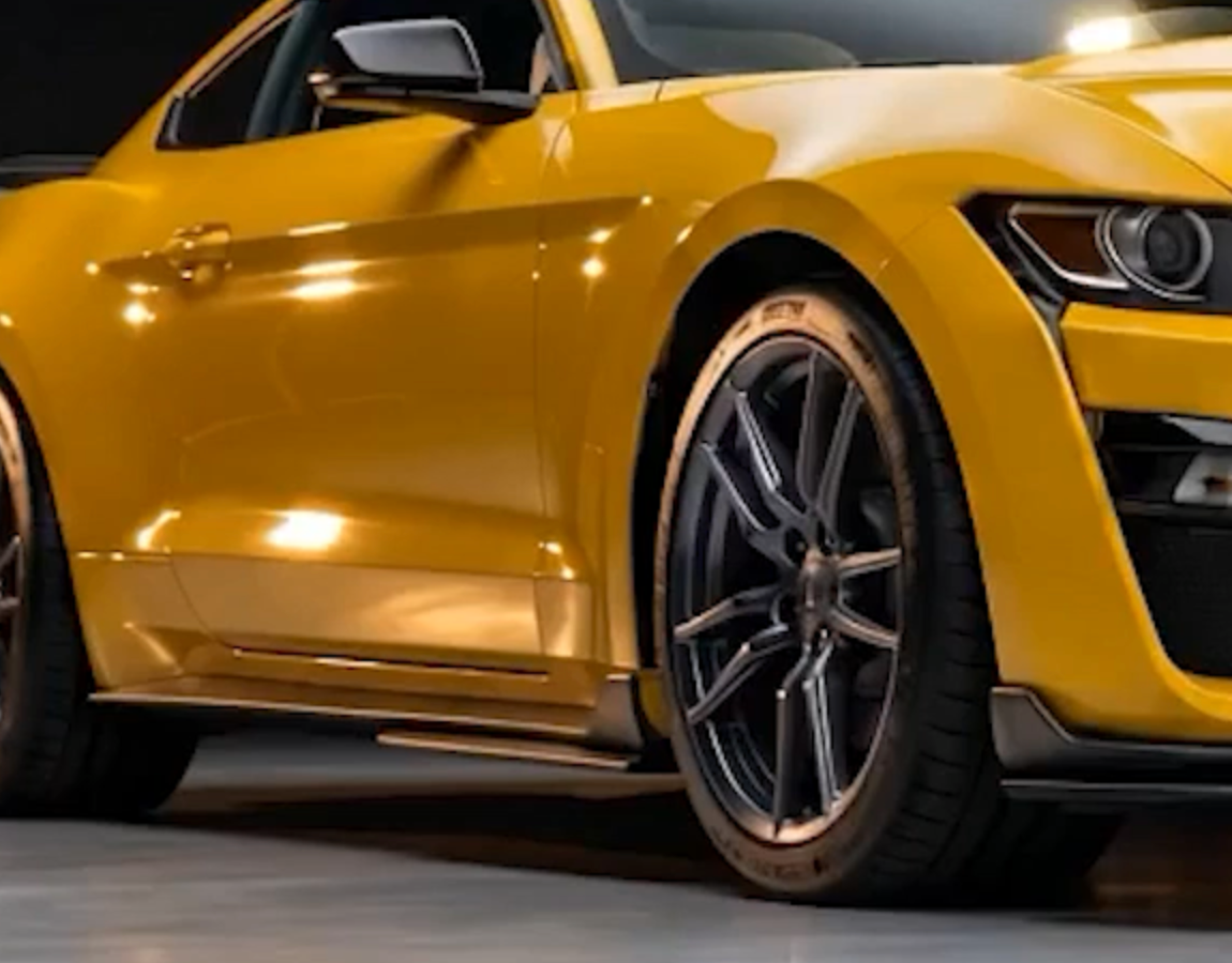 Glossy yellow Mustang body panel protected by self-healing Forever Young PPF