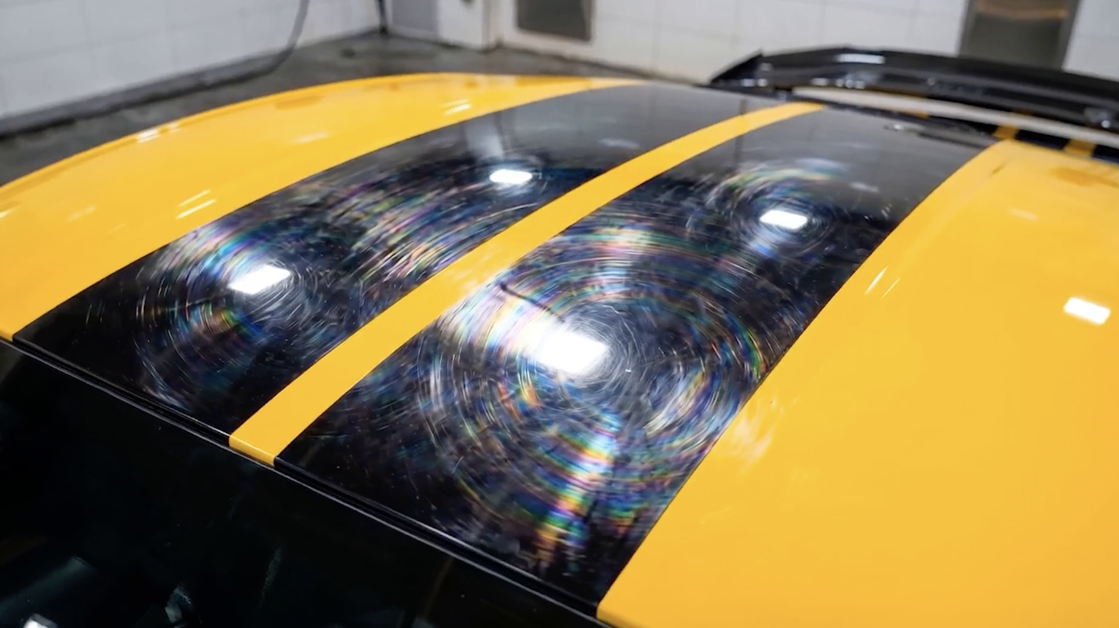Swirl marks on a glossy roof stripe that self-heal under the Forever Young PPF top coat